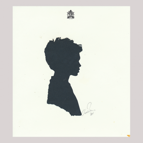 
        Front of silhouette, with boy looking right, at the top an emblem.